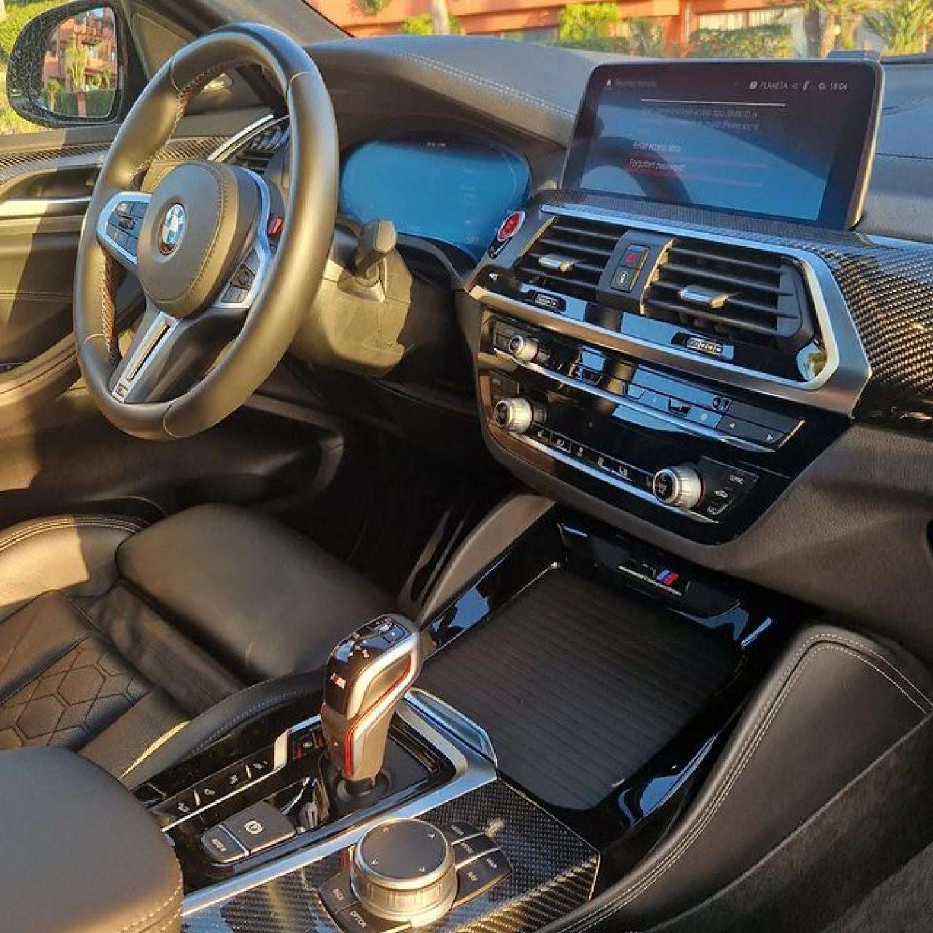 Black BMW X4 M Competition SUV for rent in Marbella – luxury 5-seater with automatic transmission and sporty design.
