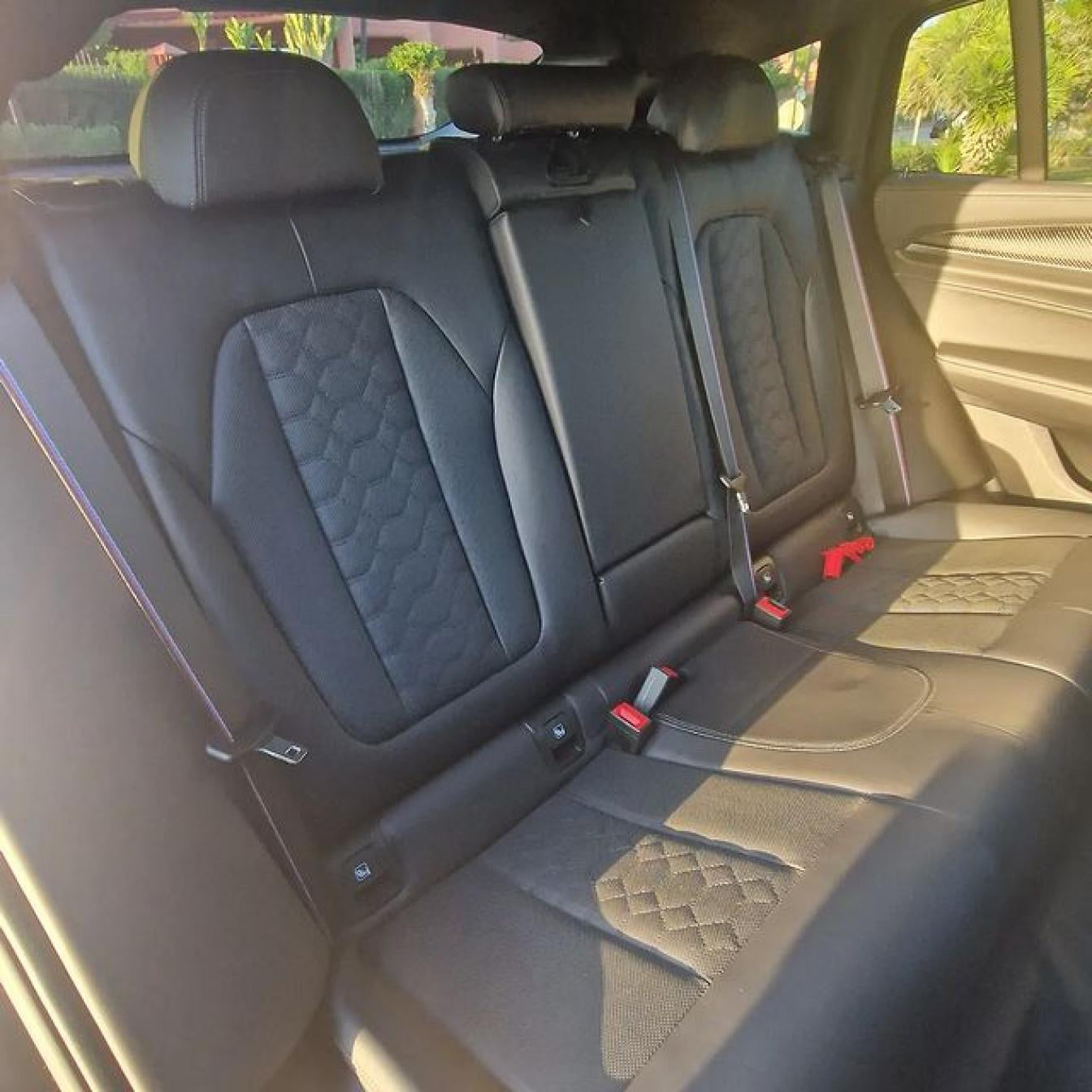 Black BMW X4 M Competition SUV for rent in Marbella – luxury 5-seater with automatic transmission and sporty design.

