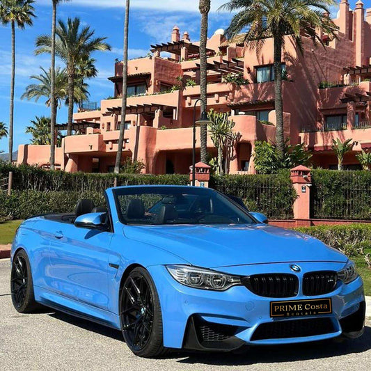 Blue BMW M4 Cabrio for rent in Marbella – automatic 4-seater convertible with sporty M styling.