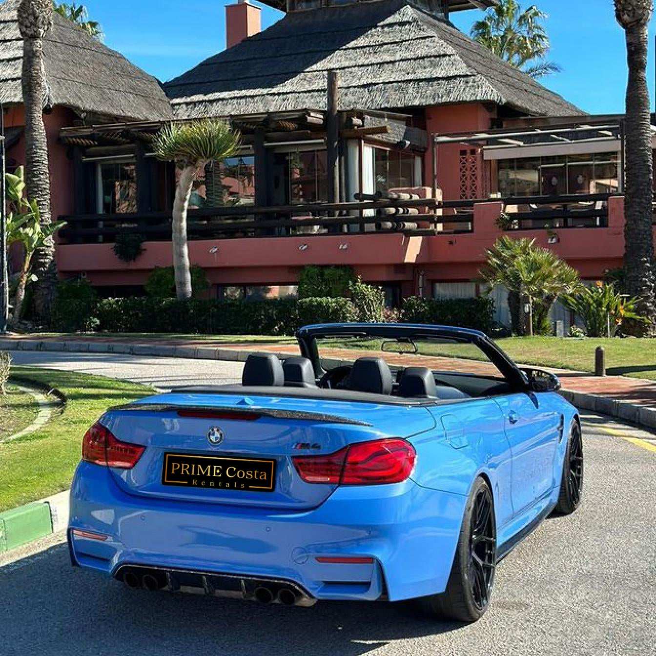 Blue BMW M4 Cabrio for rent in Marbella – automatic 4-seater convertible with sporty M styling.