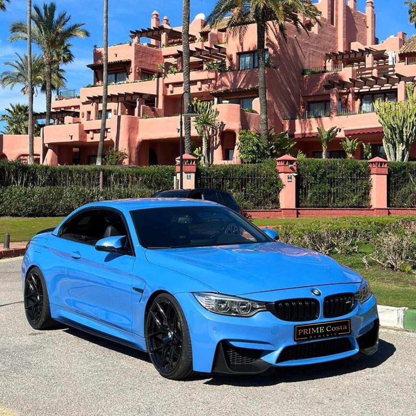 Blue BMW M4 Cabrio for rent in Marbella – automatic 4-seater convertible with sporty M styling.