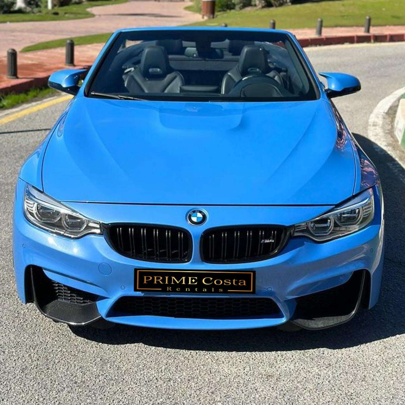 Blue BMW M4 Cabrio for rent in Marbella – automatic 4-seater convertible with sporty M styling.