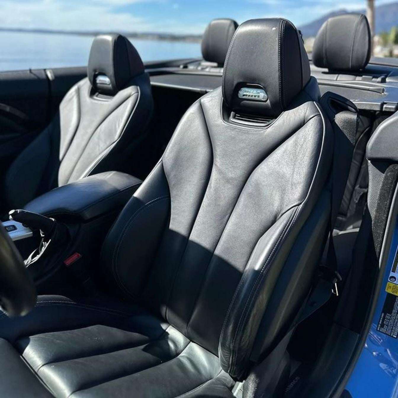 Blue BMW M4 Cabrio for rent in Marbella – automatic 4-seater convertible with sporty M styling.