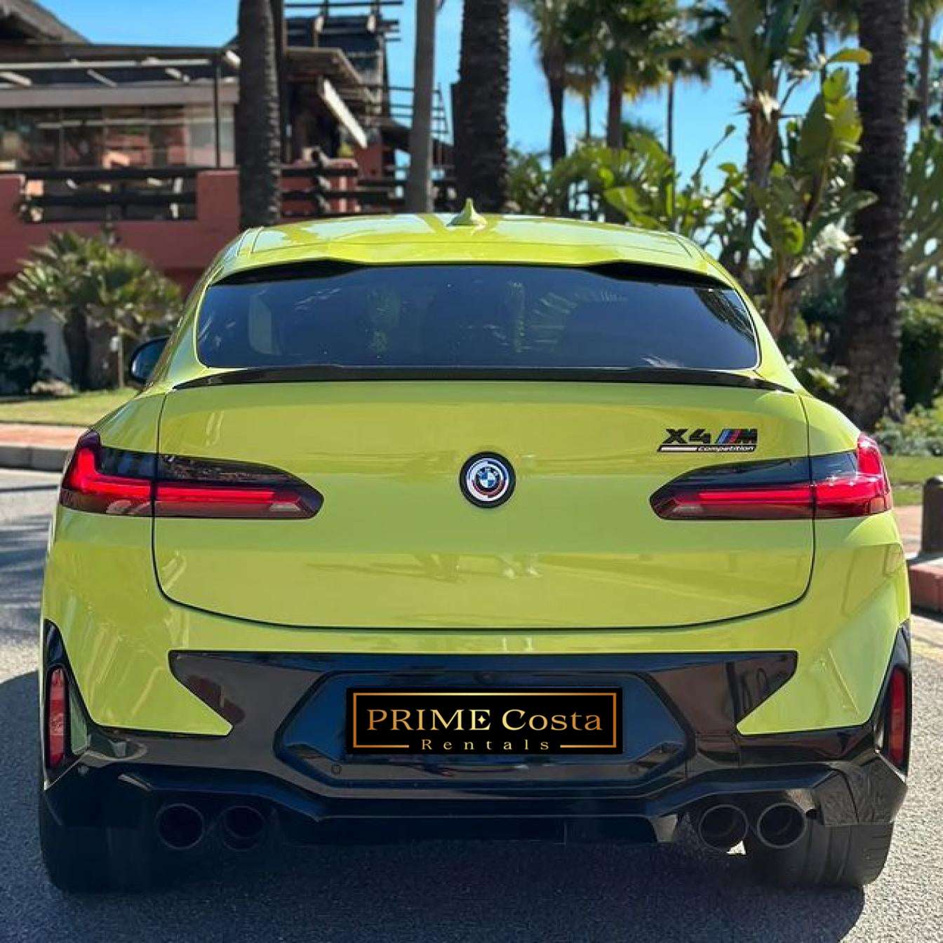 Yellow BMW X4 M Competition SUV for rent in Marbella – automatic, bold 5-seater with sporty style and premium features.