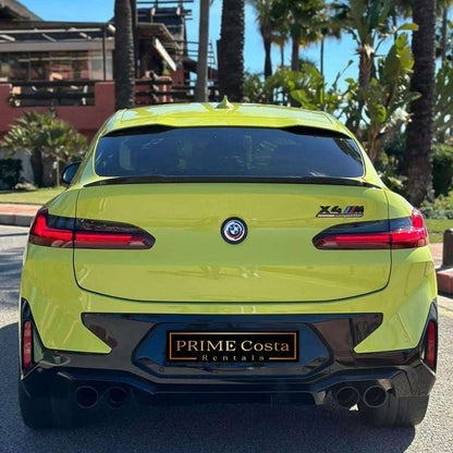 Yellow BMW X4 M Competition SUV for rent in Marbella – automatic, bold 5-seater with sporty style and premium features.