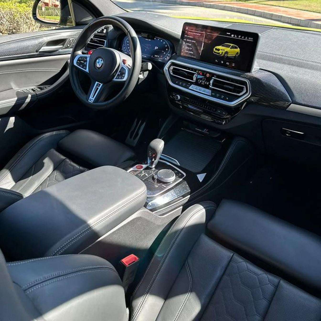 Yellow BMW X4 M Competition SUV for rent in Marbella – automatic, bold 5-seater with sporty style and premium features.