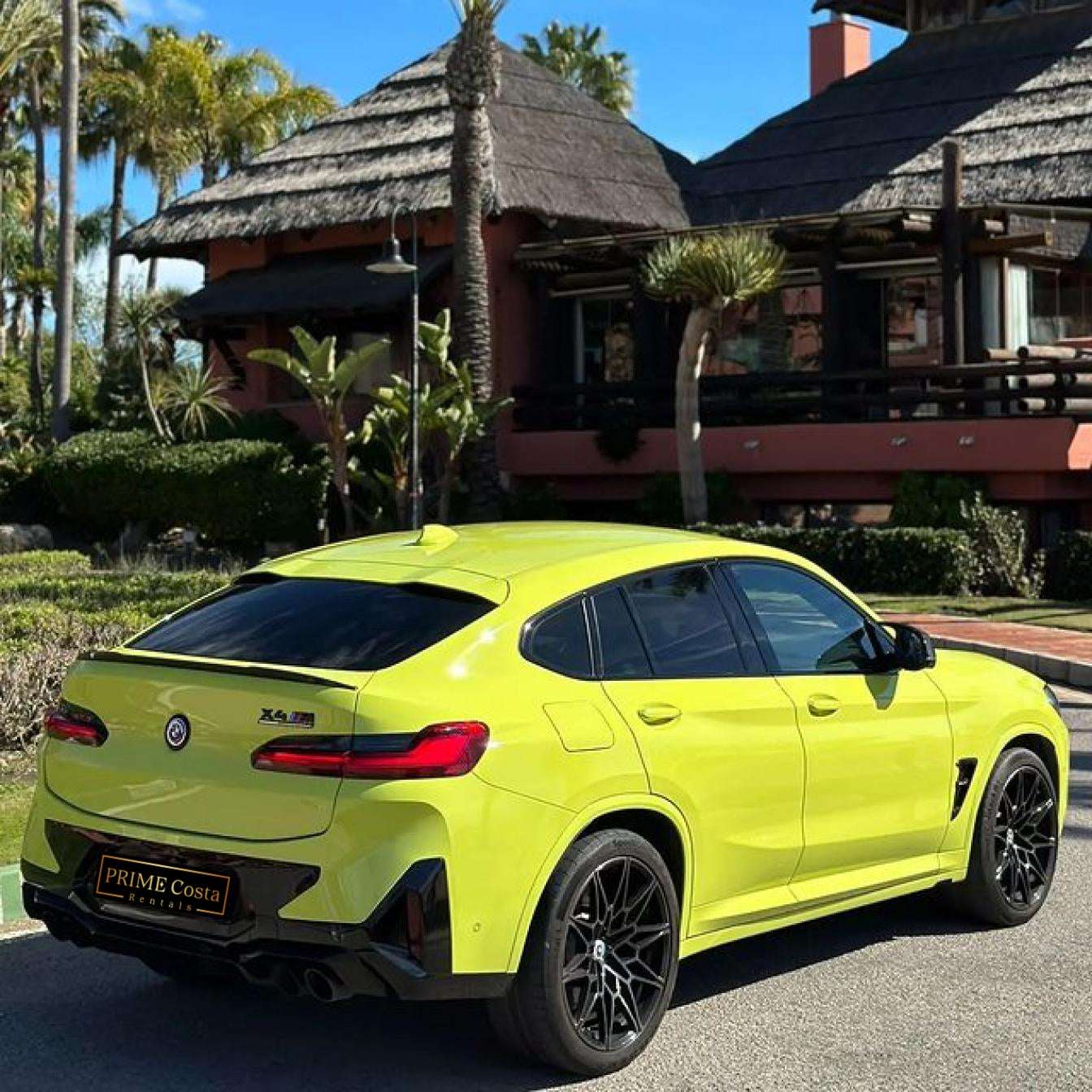 Yellow BMW X4 M Competition SUV for rent in Marbella – automatic, bold 5-seater with sporty style and premium features.