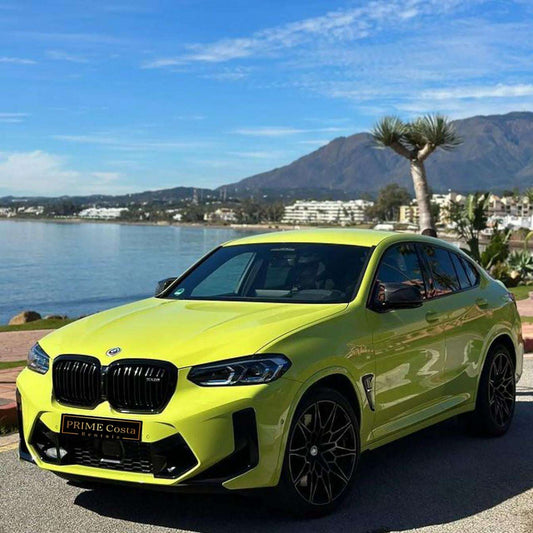 Yellow BMW X4 M Competition SUV for rent in Marbella – automatic, bold 5-seater with sporty style and premium features.