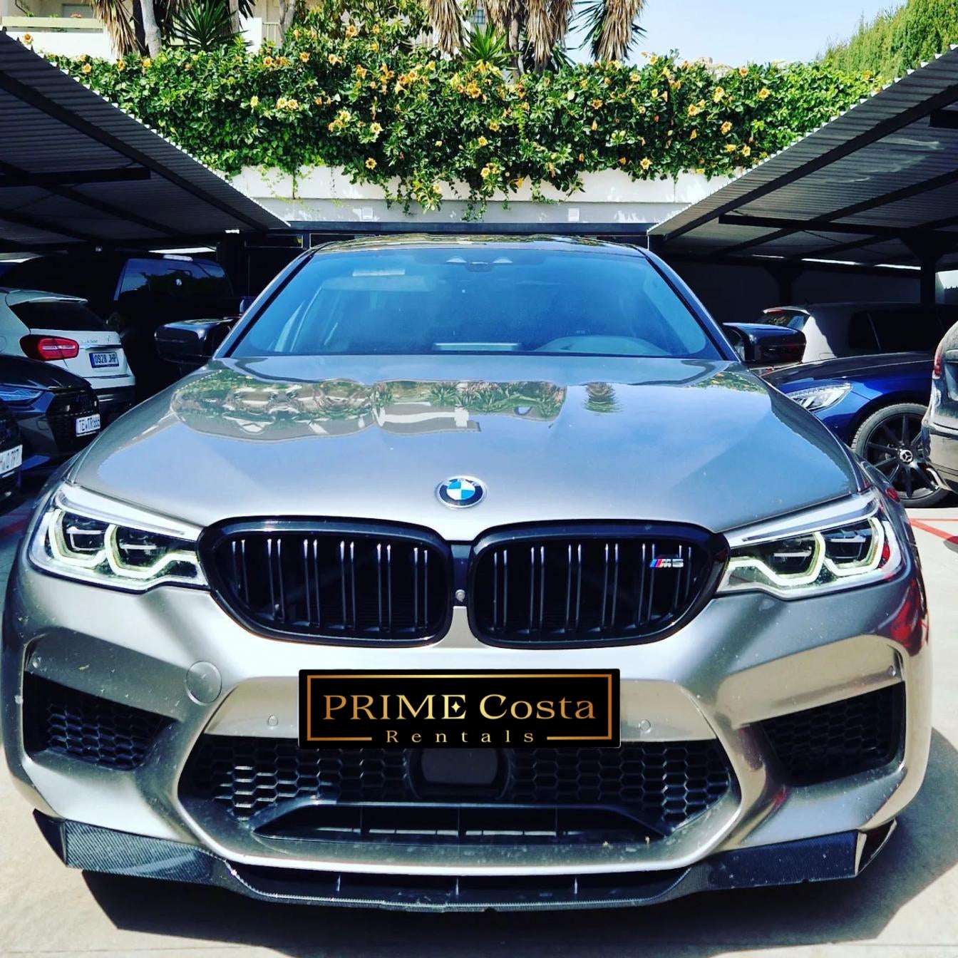 Silver BMW M5 sedan for rent in Marbella – 4.4L automatic, 4WD, 0–100 km/h in 3.4 seconds, top speed 300 km/h.