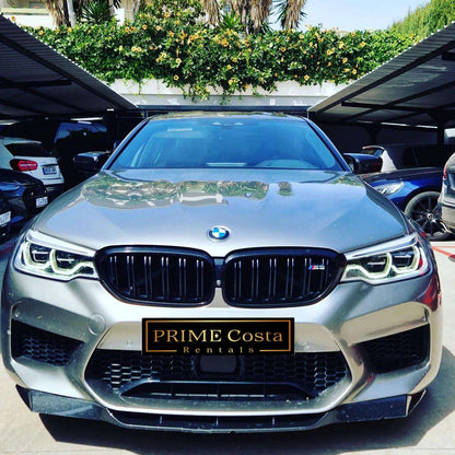 Silver BMW M5 sedan for rent in Marbella – 4.4L automatic, 4WD, 0–100 km/h in 3.4 seconds, top speed 300 km/h.