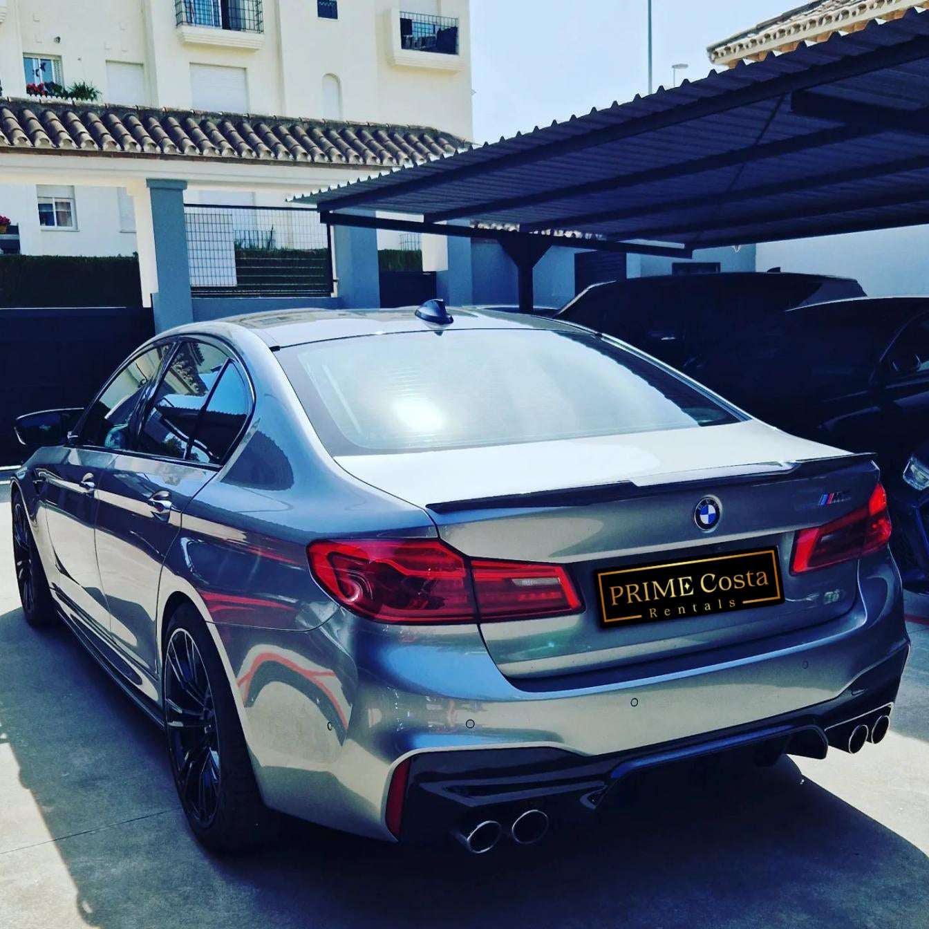Silver BMW M5 sedan for rent in Marbella – 4.4L automatic, 4WD, 0–100 km/h in 3.4 seconds, top speed 300 km/h.