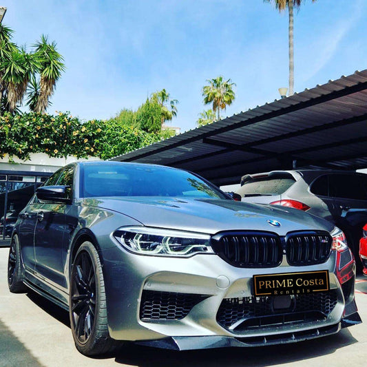 Silver BMW M5 sedan for rent in Marbella – 4.4L automatic, 4WD, 0–100 km/h in 3.4 seconds, top speed 300 km/h.