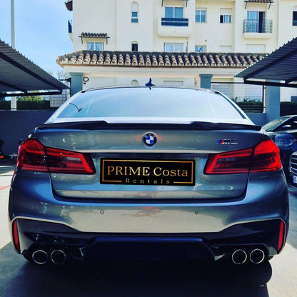 Silver BMW M5 sedan for rent in Marbella – 4.4L automatic, 4WD, 0–100 km/h in 3.4 seconds, top speed 300 km/h.