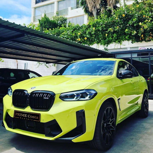 Yellow BMW X4 M Competition SUV for rent in Marbella – 503 HP, 3.0L engine, automatic 4WD, luxury 5-seater.