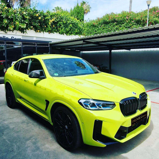 Yellow BMW X4 M Competition SUV for rent in Marbella – 503 HP, 3.0L engine, automatic 4WD, luxury 5-seater.