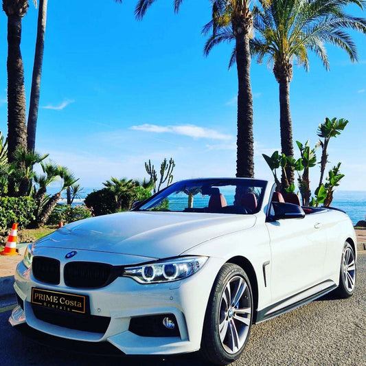 White BMW 428M Cabrio for rent in Marbella – 4-seater automatic convertible, 2.0L engine, sporty and stylish.