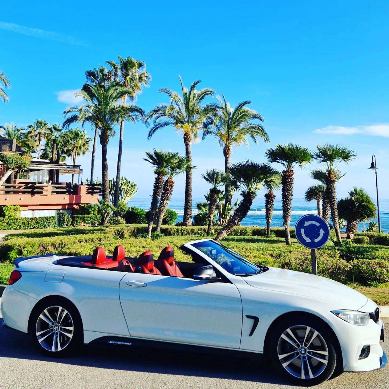 White BMW 428M Cabrio for rent in Marbella – 4-seater automatic convertible, 2.0L engine, sporty and stylish.