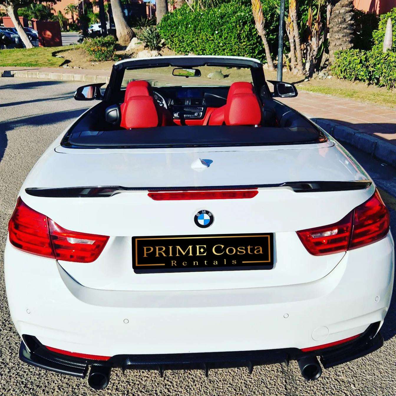 White BMW 428M Cabrio for rent in Marbella – 4-seater automatic convertible, 2.0L engine, sporty and stylish.