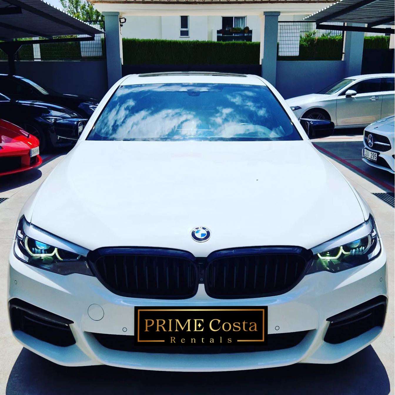 White BMW 540i F90 sedan for rent in Marbella – 3.0L engine, 333 HP, 0–100 in 4.6 sec, automatic 5-seater.