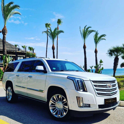 White Cadillac Escalade SUV for rent in Marbella – 6.2L V8, automatic 4WD, 7-seater luxury vehicle.
