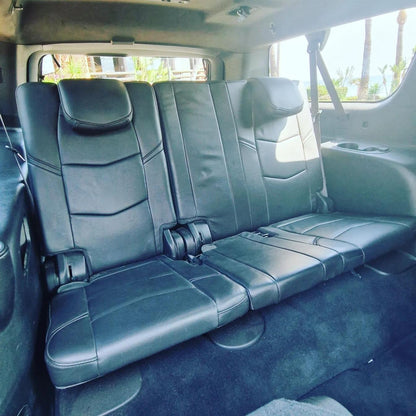 White Cadillac Escalade SUV for rent in Marbella – 6.2L V8, automatic 4WD, 7-seater luxury vehicle.

