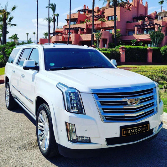 White Cadillac Escalade SUV for rent in Marbella – 6.2L V8, automatic 4WD, 7-seater luxury vehicle.
