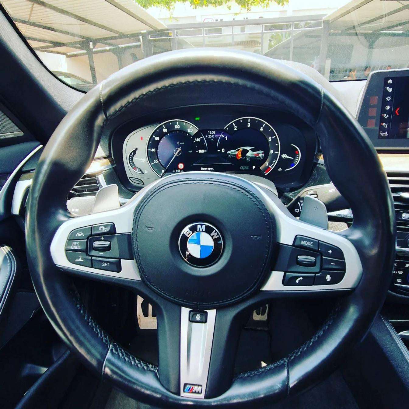 White BMW 540i F90 sedan for rent in Marbella – 3.0L engine, 333 HP, 0–100 in 4.6 sec, automatic 5-seater.