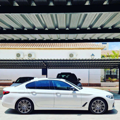 White BMW 540i F90 sedan for rent in Marbella – 3.0L engine, 333 HP, 0–100 in 4.6 sec, automatic 5-seater.