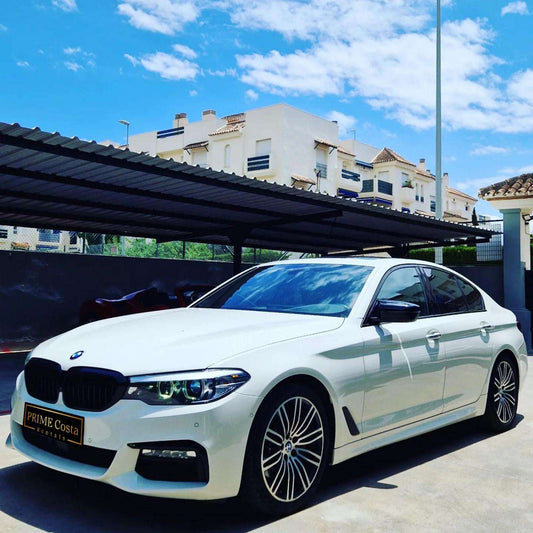 White BMW 540i F90 sedan for rent in Marbella – 3.0L engine, 333 HP, 0–100 in 4.6 sec, automatic 5-seater.