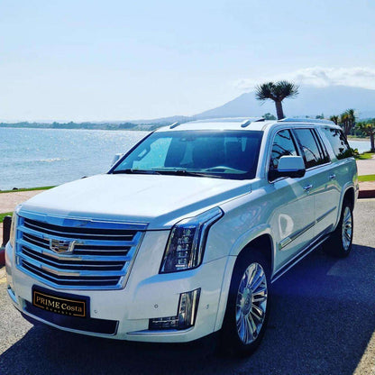 White Cadillac Escalade SUV for rent in Marbella – 6.2L V8, automatic 4WD, 7-seater luxury vehicle.
