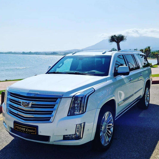 White Cadillac Escalade SUV for rent in Marbella – 6.2L V8, automatic 4WD, 7-seater luxury vehicle.
