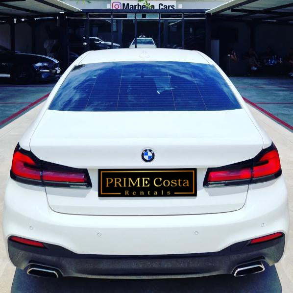 White BMW 540i F90 sedan for rent in Marbella – 3.0L engine, 333 HP, 0–100 in 4.6 sec, automatic 5-seater.