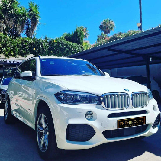 White BMW X5 M XDrive SUV for rent in Marbella – 4.0L diesel, 400 HP, automatic 4WD with seating for 5.