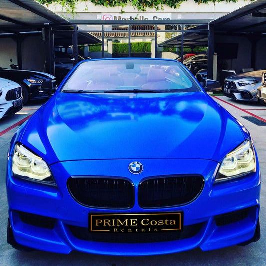 Blue BMW 640i M Cabrio for rent in Marbella – automatic convertible with 350 HP, 4.1s 0–100 km/h, and 4 seats.