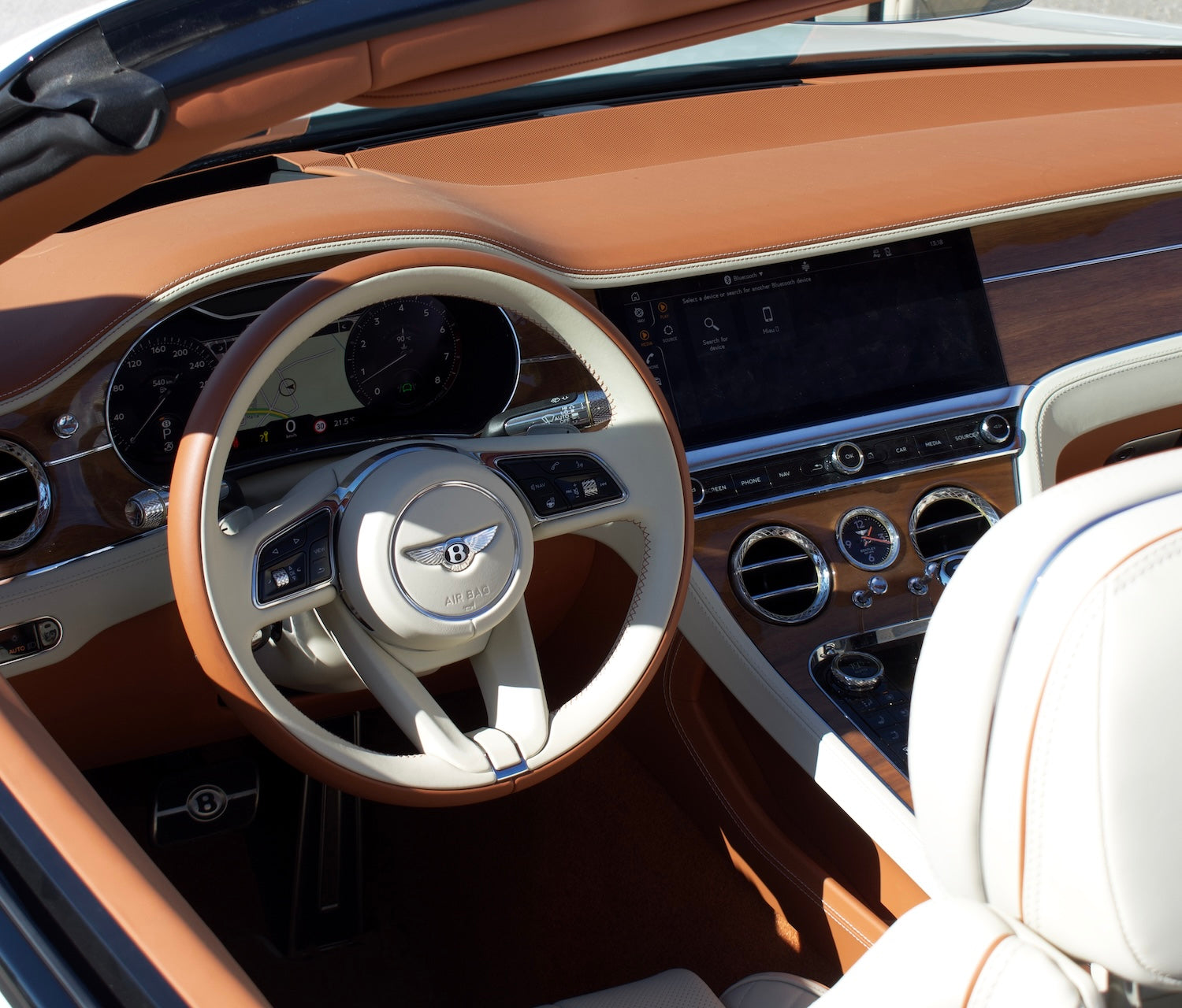 Front view of a white 2024 Bentley Continental GT Cabrio parked in Marbella, available for luxury rental.