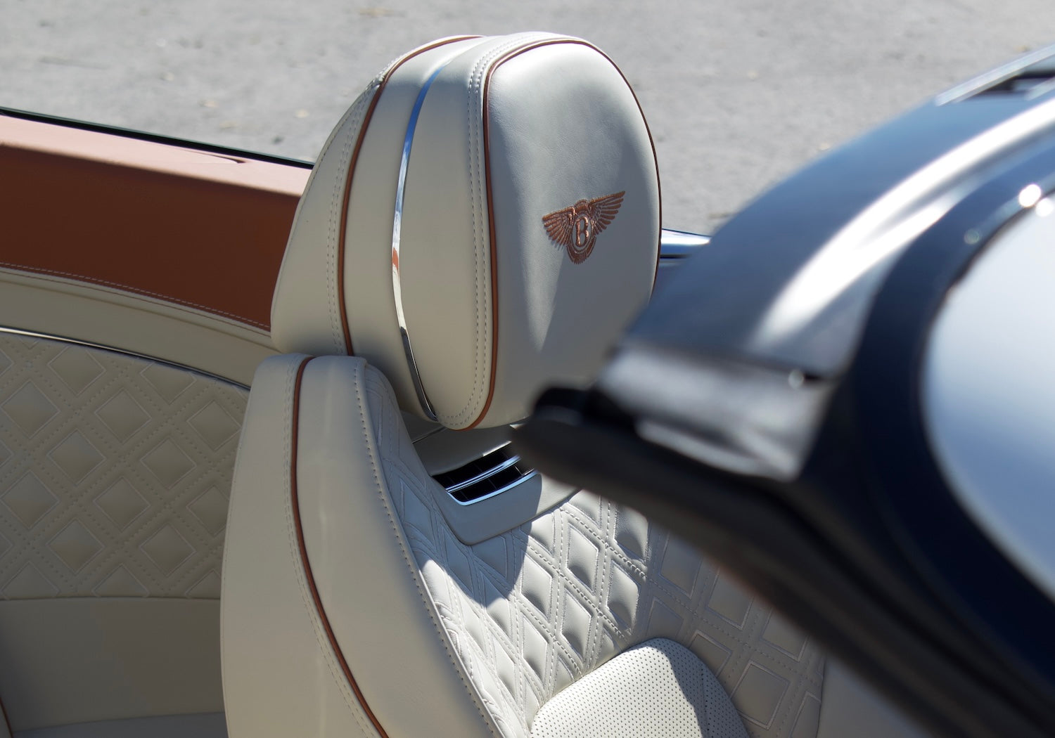 Front view of a white 2024 Bentley Continental GT Cabrio parked in Marbella, available for luxury rental.