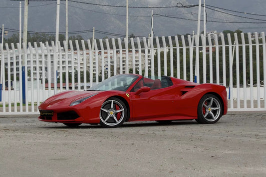 Red 2018 Ferrari 488 Spider convertible parked in Marbella, available for rent from Prime Costa Rentals.

