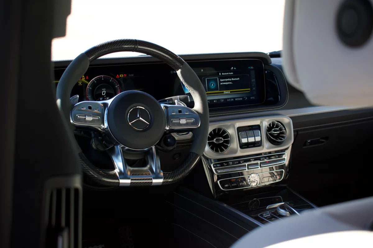 White 2023 Mercedes-AMG G 63 luxury SUV parked in Marbella, available for rent at Prime Costa Rentals.
