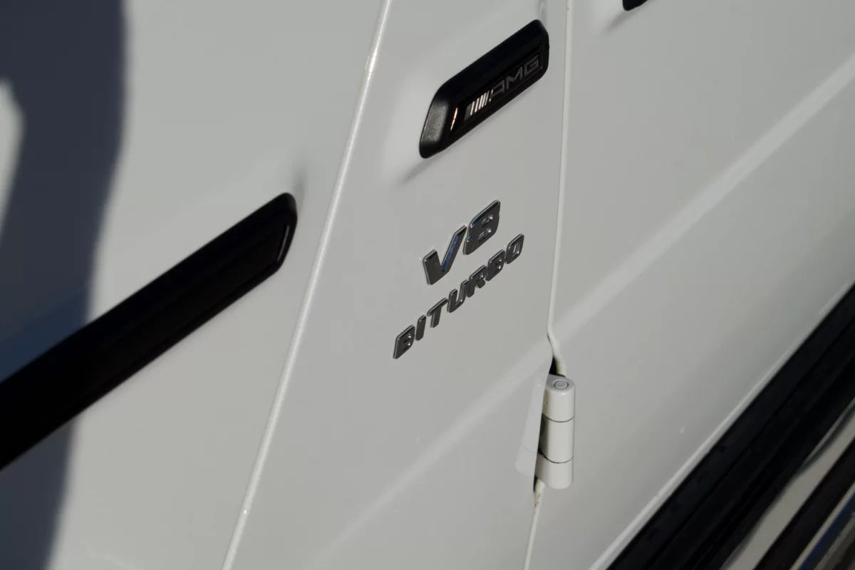 White 2023 Mercedes-AMG G 63 luxury SUV parked in Marbella, available for rent at Prime Costa Rentals.
