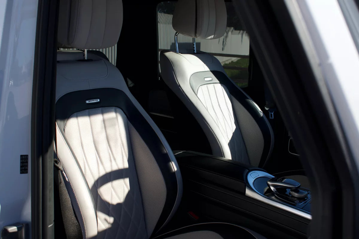 White 2023 Mercedes-AMG G 63 luxury SUV parked in Marbella, available for rent at Prime Costa Rentals.
