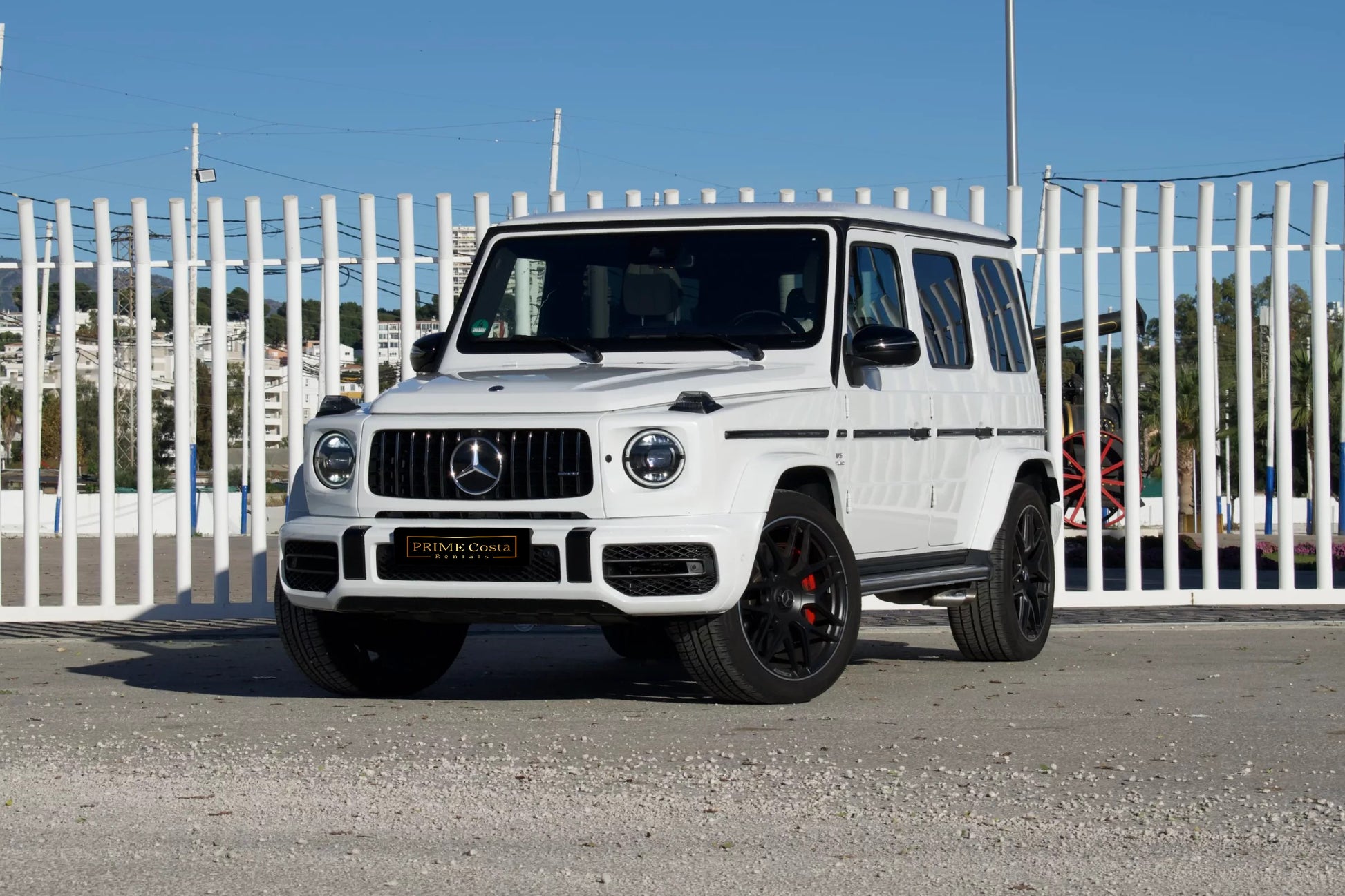 White 2023 Mercedes-AMG G 63 luxury SUV parked in Marbella, available for rent at Prime Costa Rentals.
