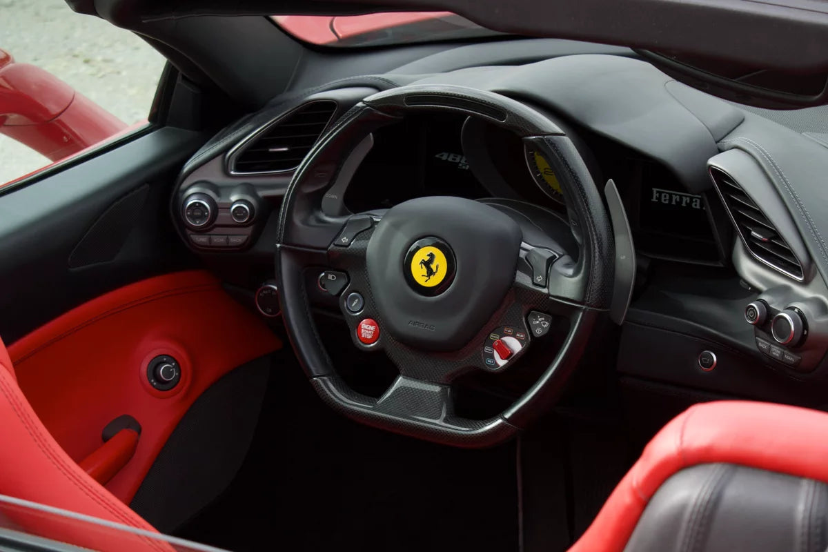 Red 2018 Ferrari 488 Spider convertible parked in Marbella, available for rent from Prime Costa Rentals.
