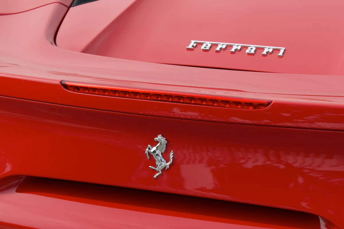 Red 2018 Ferrari 488 Spider convertible parked in Marbella, available for rent from Prime Costa Rentals.
