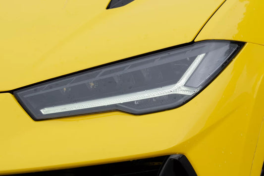 Yellow 2023 Lamborghini Urus S luxury SUV parked in Marbella, available for rent at Prime Costa Rentals.
