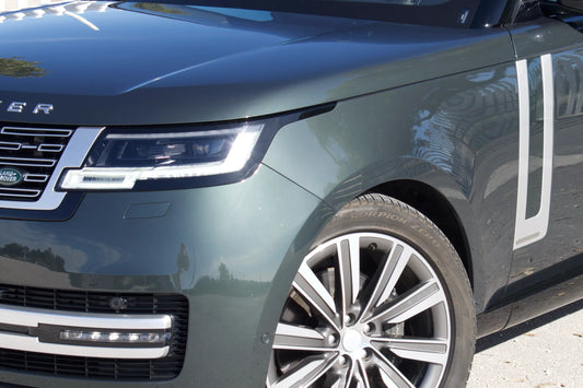 Green 2022 Range Rover Autobiography SUV parked in Marbella, available for rent from Prime Costa Rentals.