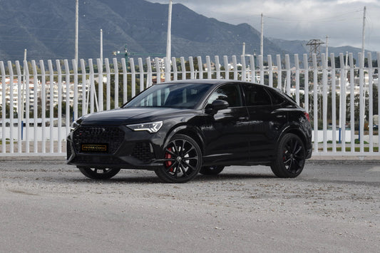 Black 2023 Audi RS Q3 Sportback SUV parked in Marbella, available for rent from Prime Costa Rentals.
