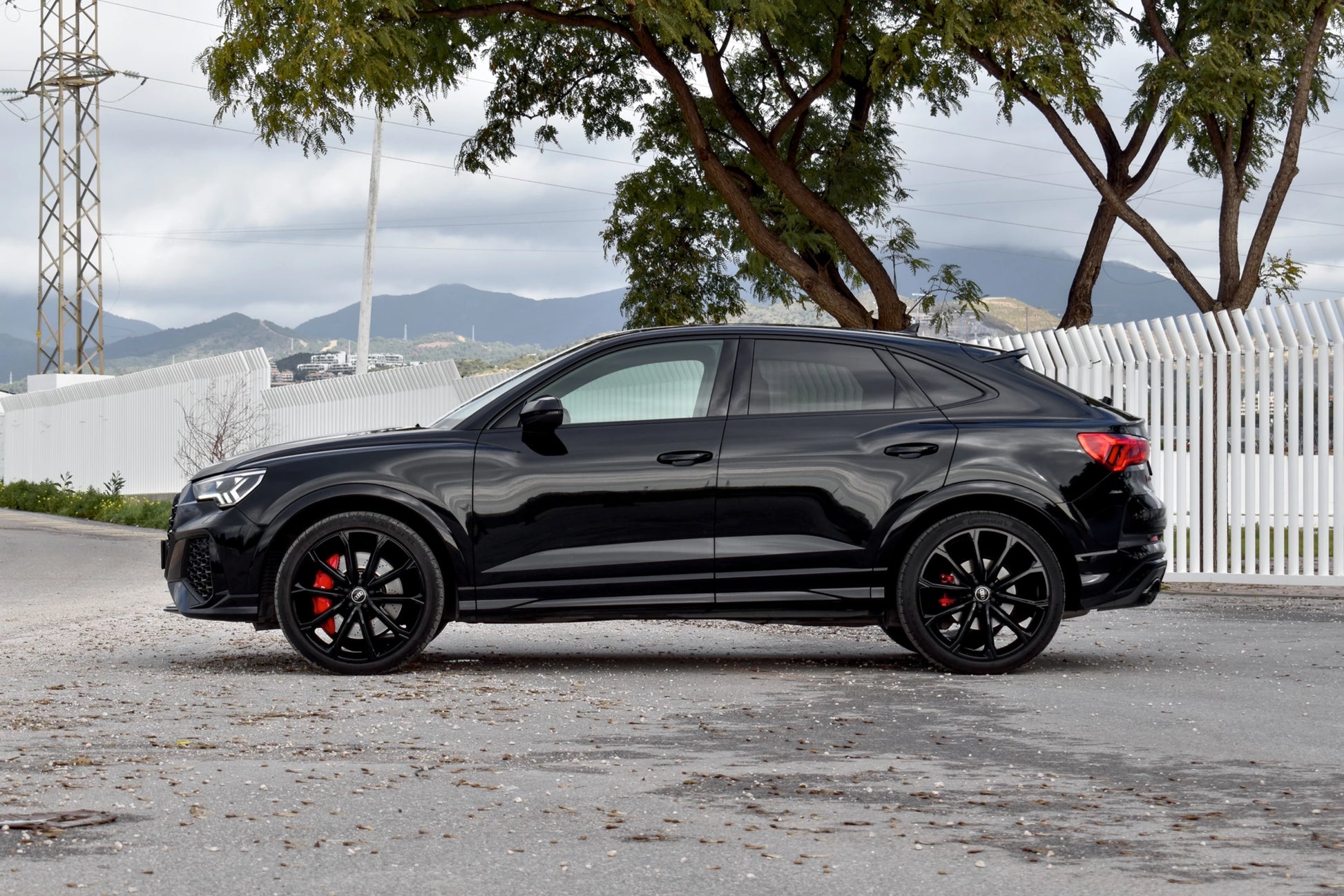 Black 2023 Audi RS Q3 Sportback SUV parked in Marbella, available for rent from Prime Costa Rentals.
