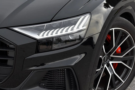 Black 2023 Audi SQ8 luxury SUV parked in Marbella, available for rent from Prime Costa Rentals.
