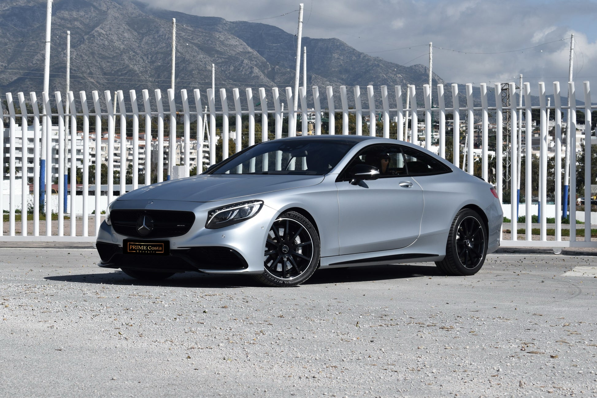 Grey 2017 Mercedes-AMG S 63 Coupe parked in Marbella, available for rent from Prime Costa Rentals.