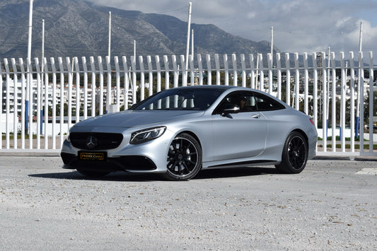 Grey 2017 Mercedes-AMG S 63 Coupe parked in Marbella, available for rent from Prime Costa Rentals.